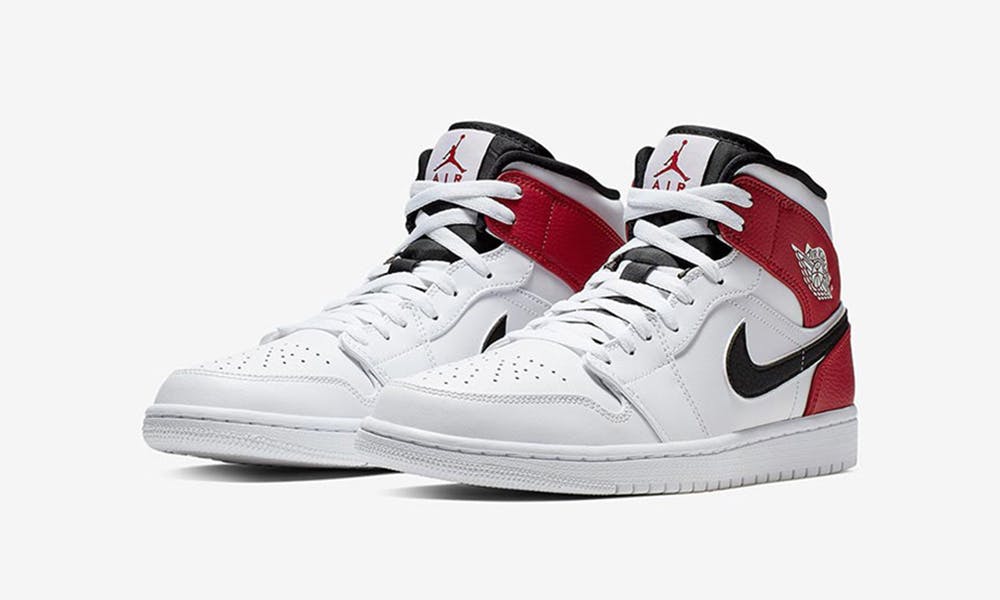 black and white jordan 1 with red swoosh